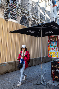 Tourist and vendor at Notre Dame Cathedral after the fire