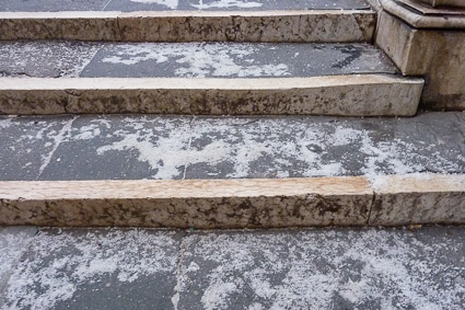 Salt on icy bridge steps in Venice, Italy