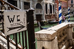 Handwritten WC directional sign in Venice, Italy.