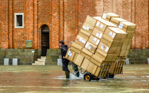 Delivery man in Piazza San Marco, Venice.